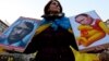 Czech Republic – Protestor holds anti Putin banner during a rally in protest against the Russian military actions in Crimea, in Prague, Czech Republic, 08 March 2014