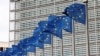 European Union flags flutter outside the EU Commission headquarters in Brussels